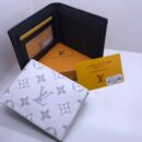 Louis Vuitton Wallets. Each wallet, complete with its elegant box, is a statement of vibrant luxury and impeccable design - 4